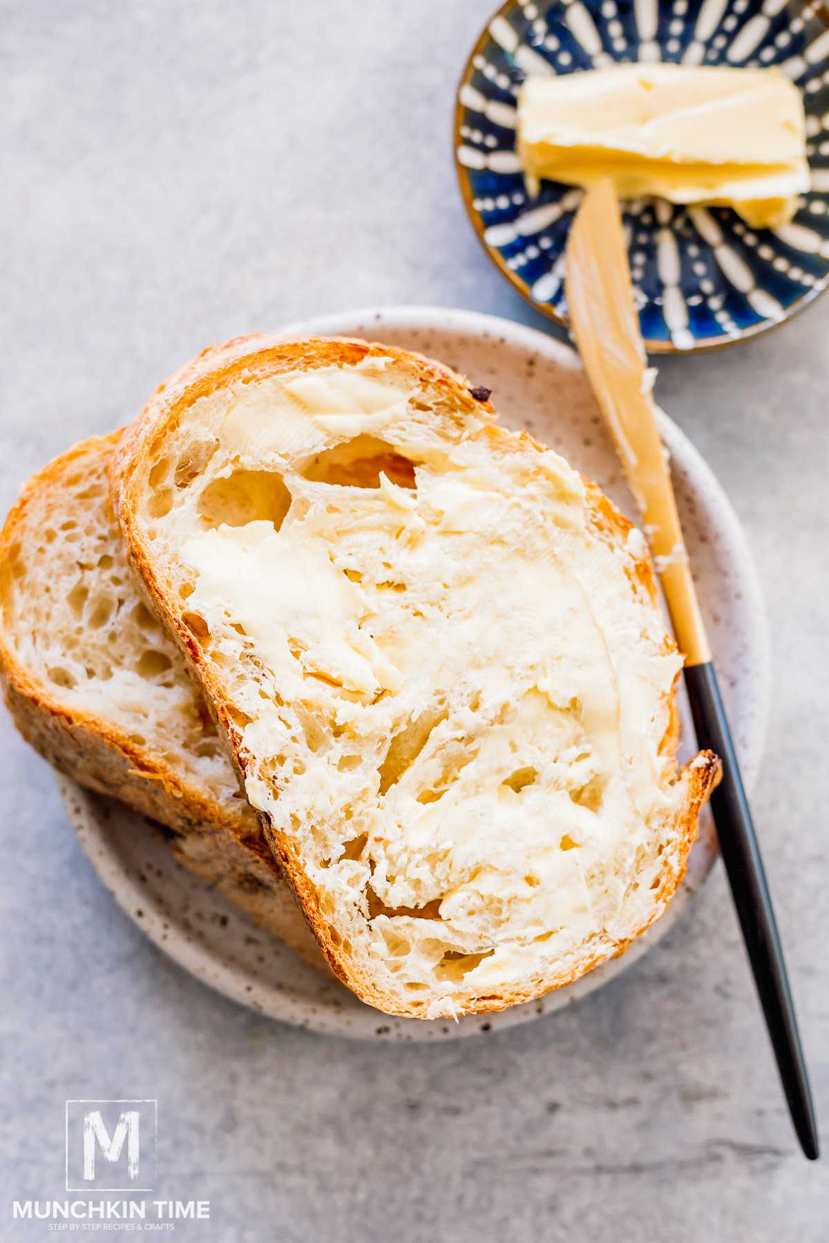 butter spread over sourdough bread slice.