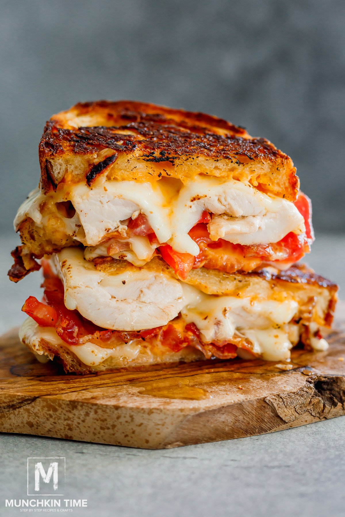 grilled cheese chicken sandwich cut in half.