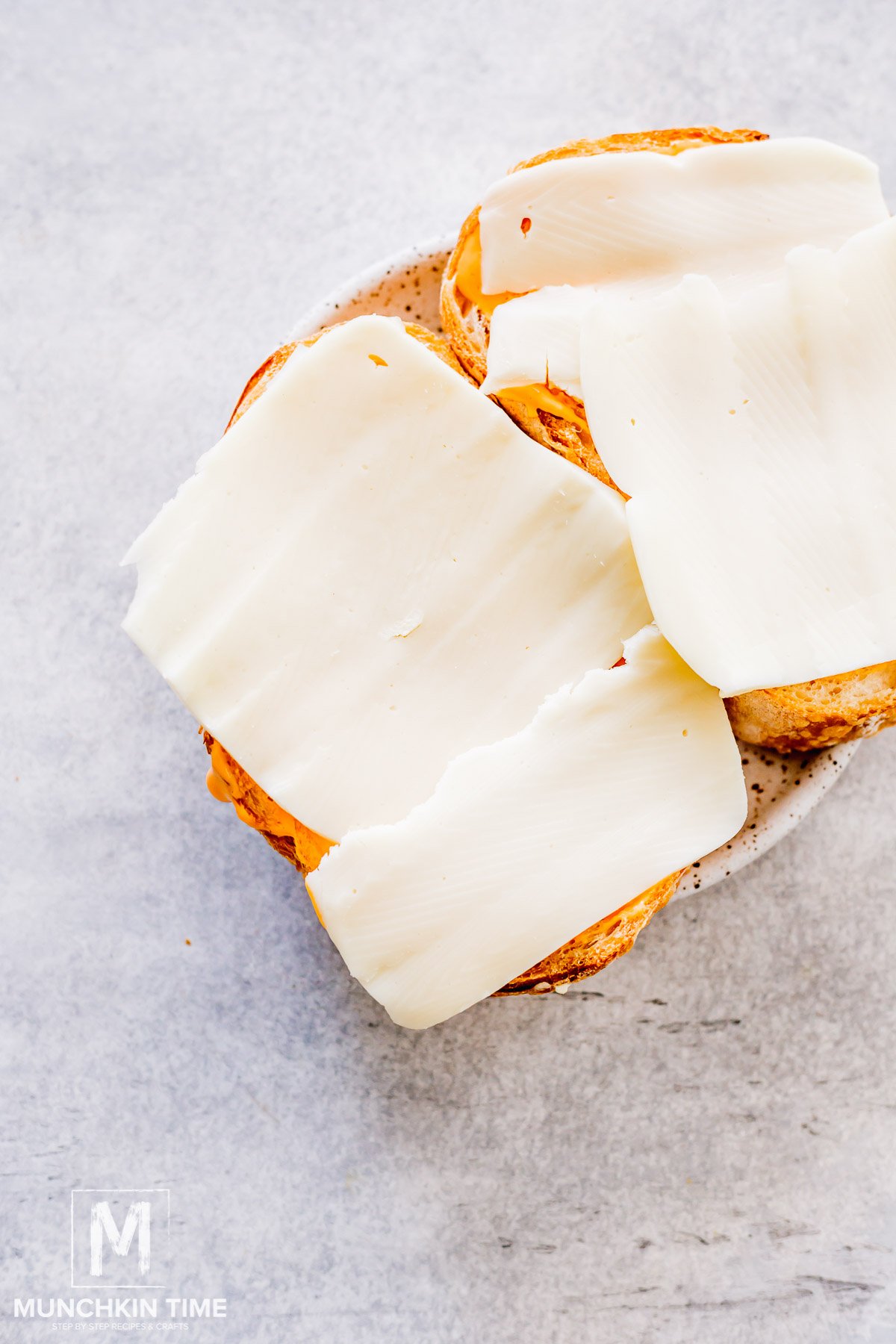 cheese added to the top of the bread.