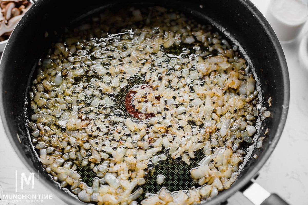 onion added to the skillet where chicken was cooking.