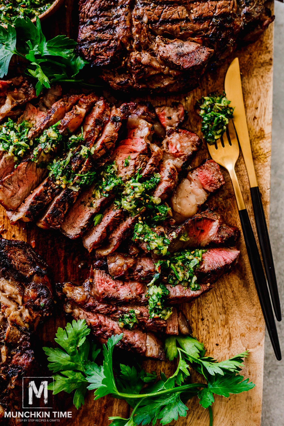 Sliced Grilled Ribeye Steak with chimichurri sauce.