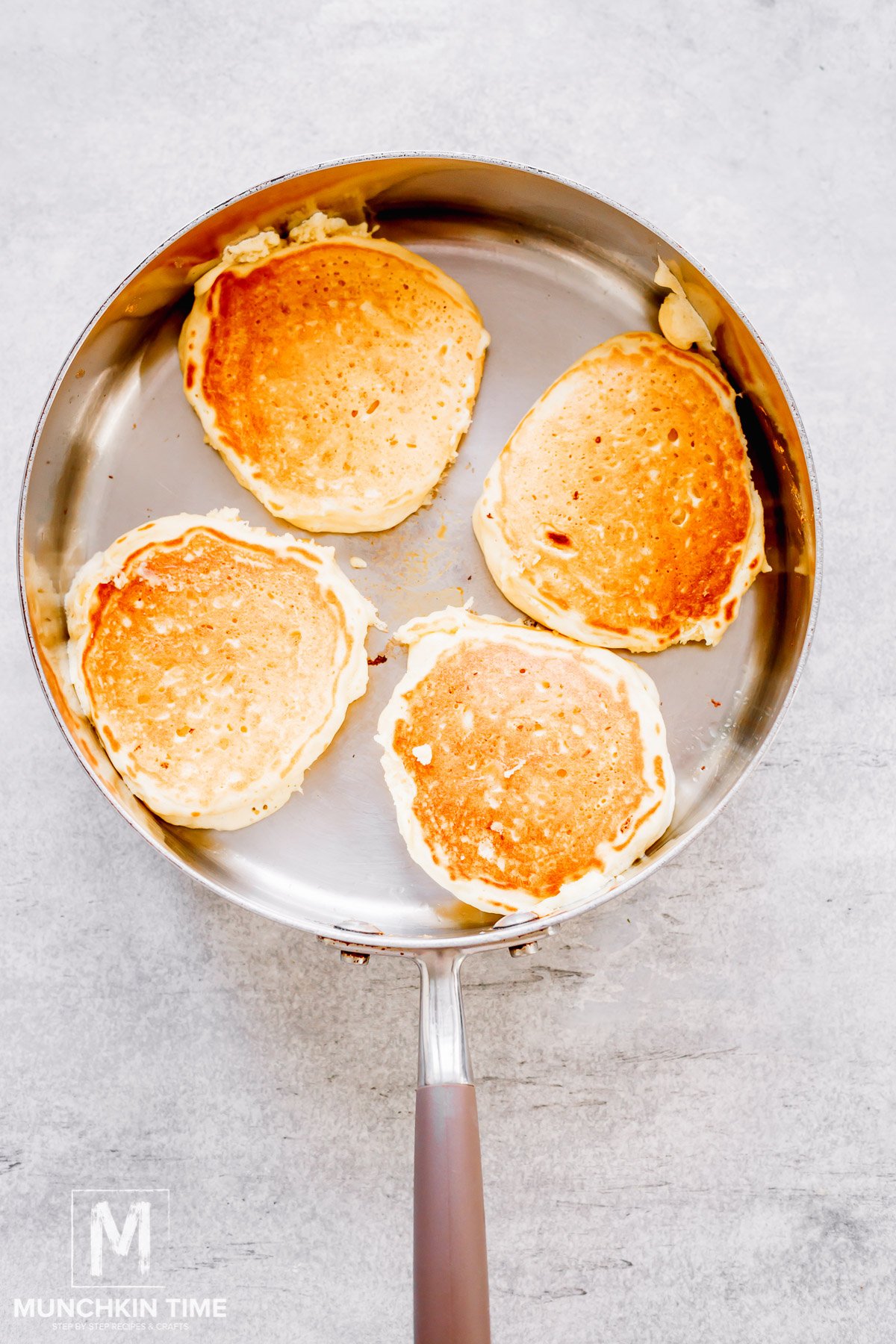 Sourdough Discard Pancakes cooking in the skillet.