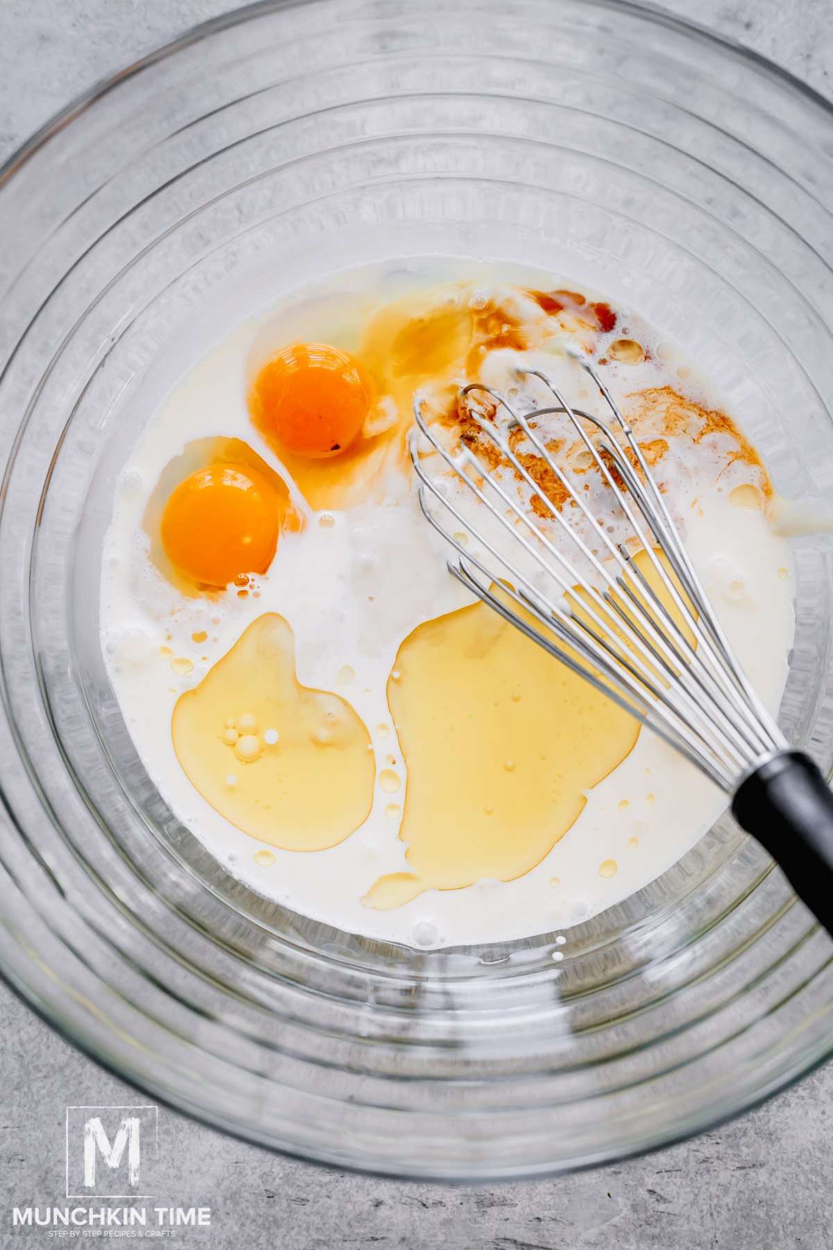 wet ingredients in a bowl with a wisk.