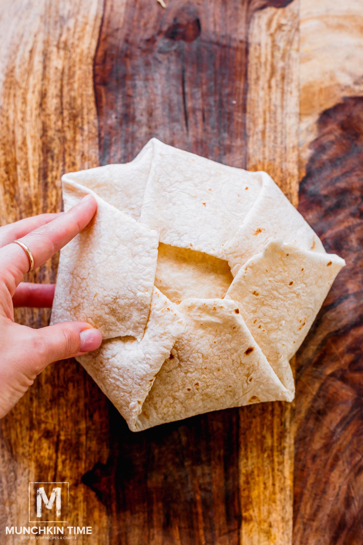 Crunch Wrap Supreme folded and ready to be cooked.