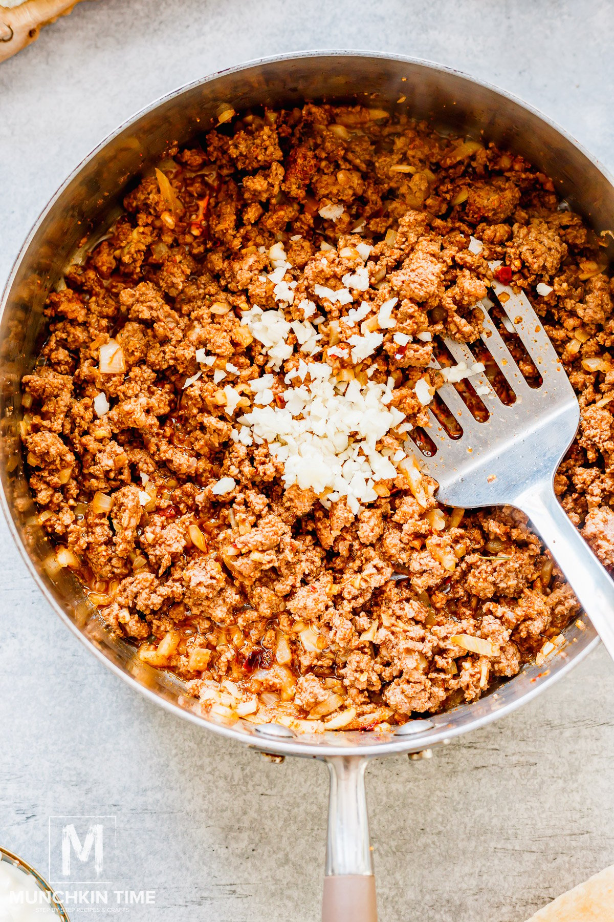 Cooked meat in the skillet plus garlic.