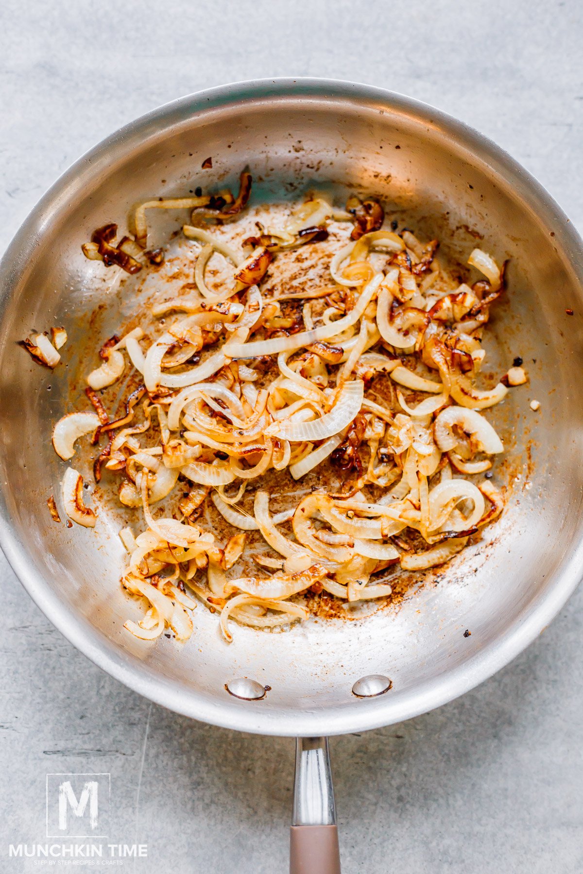 Cooked caramelized onion in the skillet.