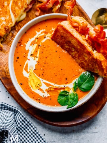 Creamy Tomato Bisque Soup with bacon grilled cheese sandwich. 