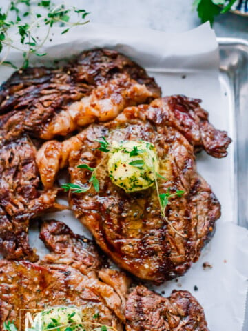 Grilled Ribeye with garlic butter on top.