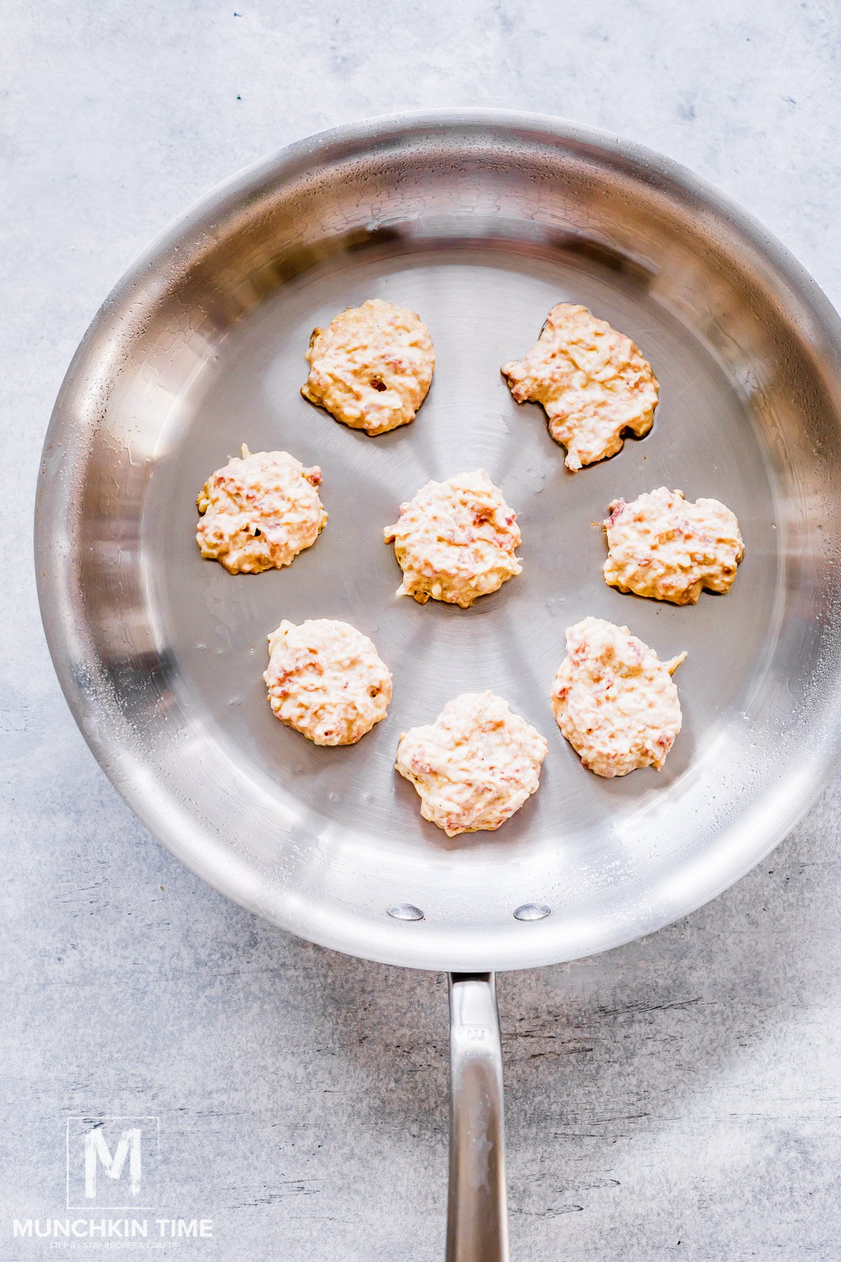 meat mixture added to the skillet using small scoop.