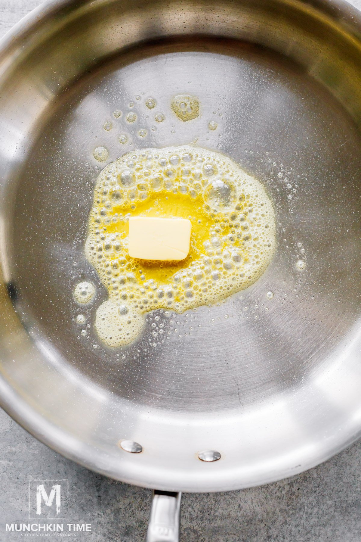 Butter melting in a skillet.