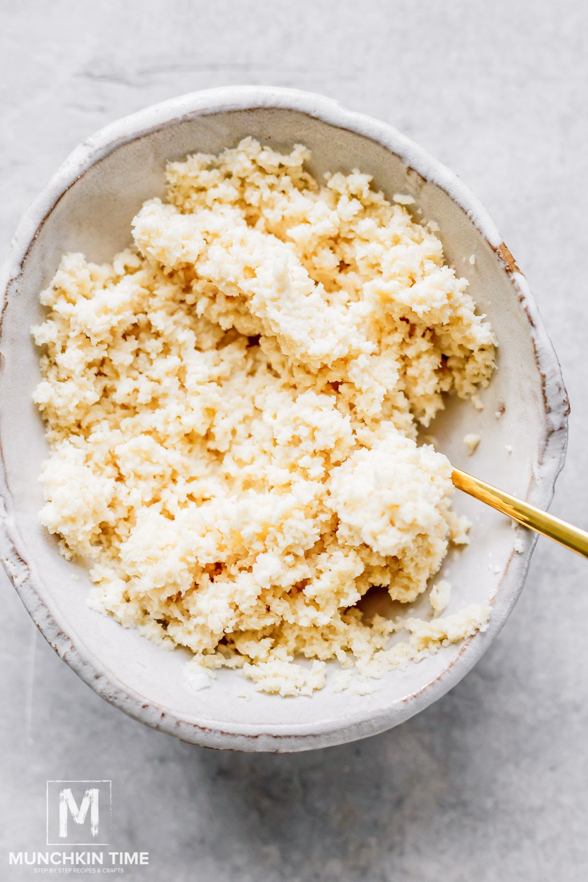 Mixed breadcrumbs and milk in a bowl.