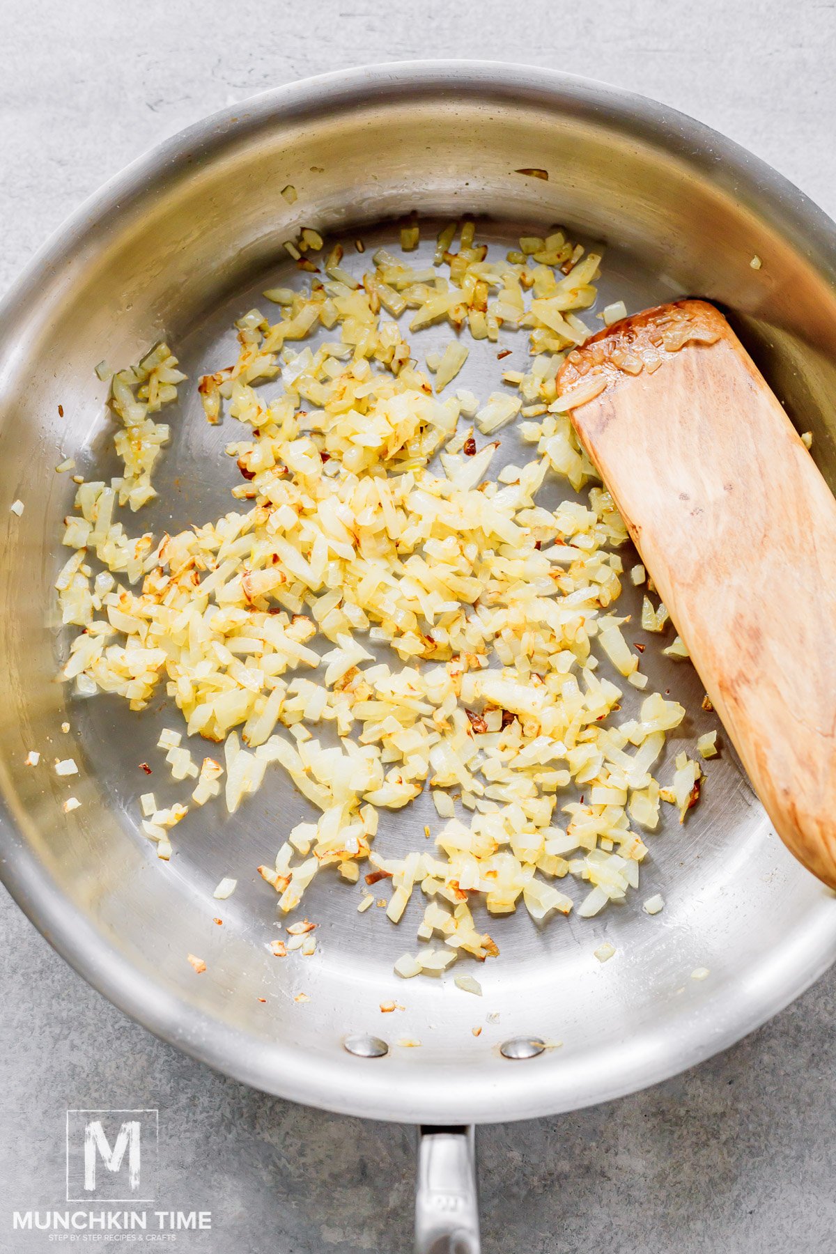 Golden color onion in the skillet.