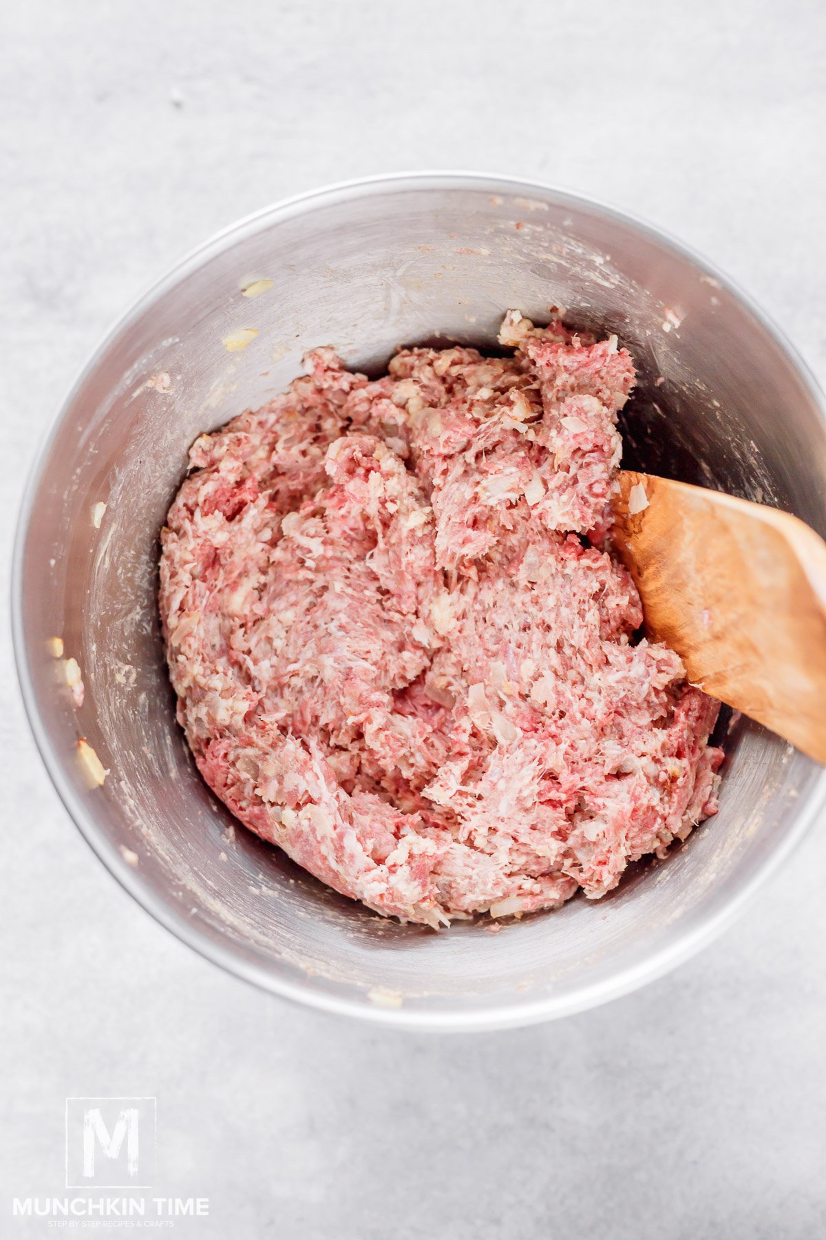 mixed meatball ingredients in a mixing bowl.