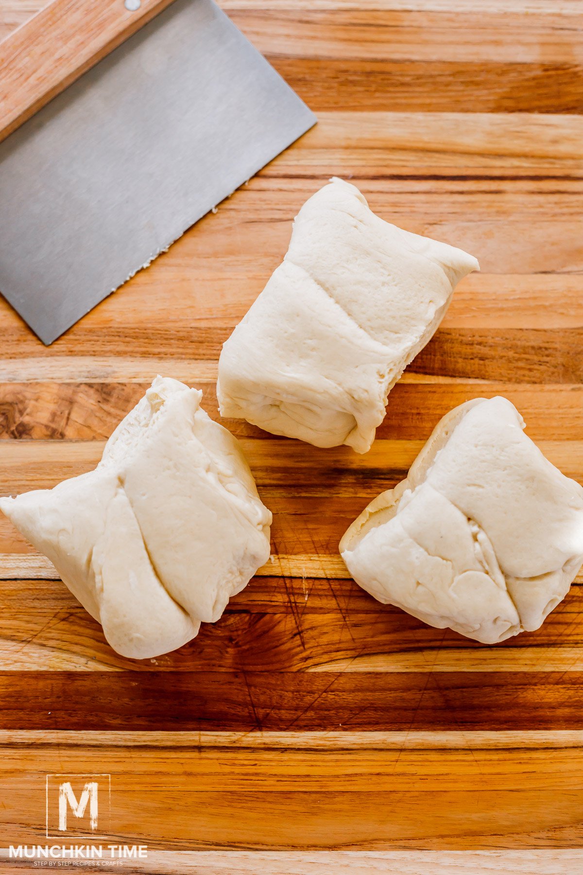 dough cut into 3 equal parts.