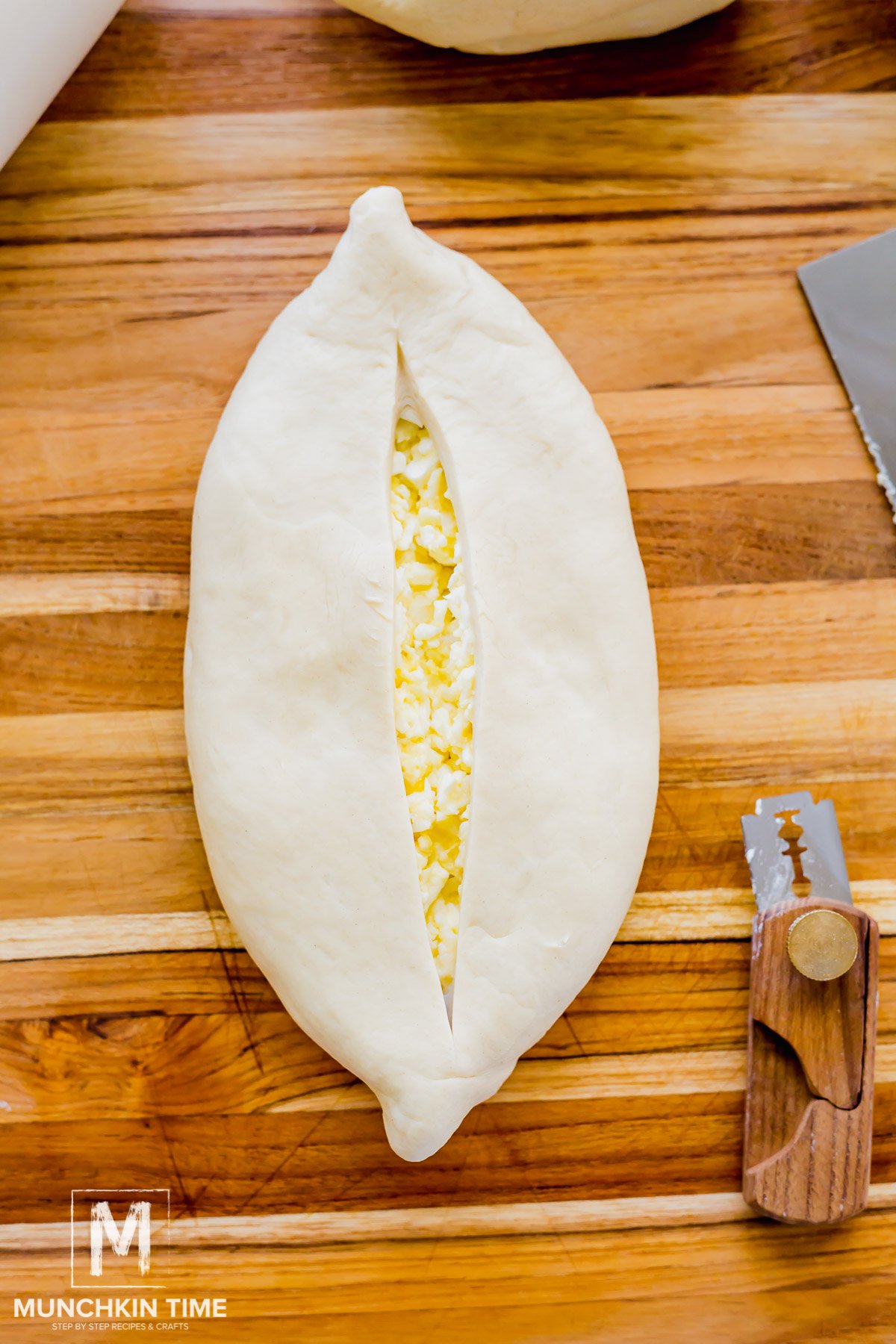 dough is cut on top to create an opening.