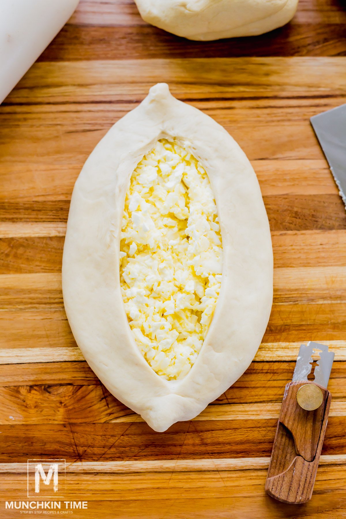 Dough spread to side to create a boat-shape form.