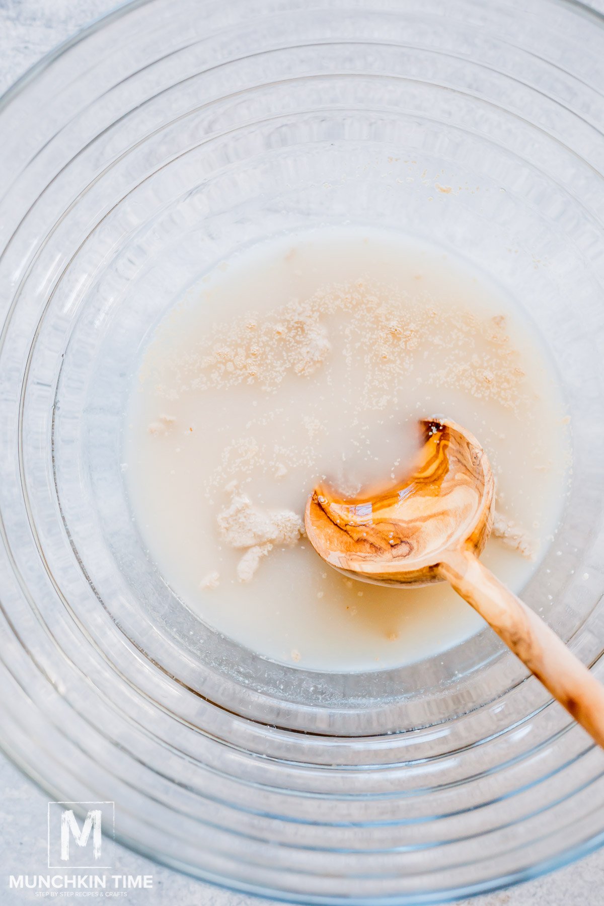 Combine the yeast, sugar, and warm water in the bowl of a stand mixer.