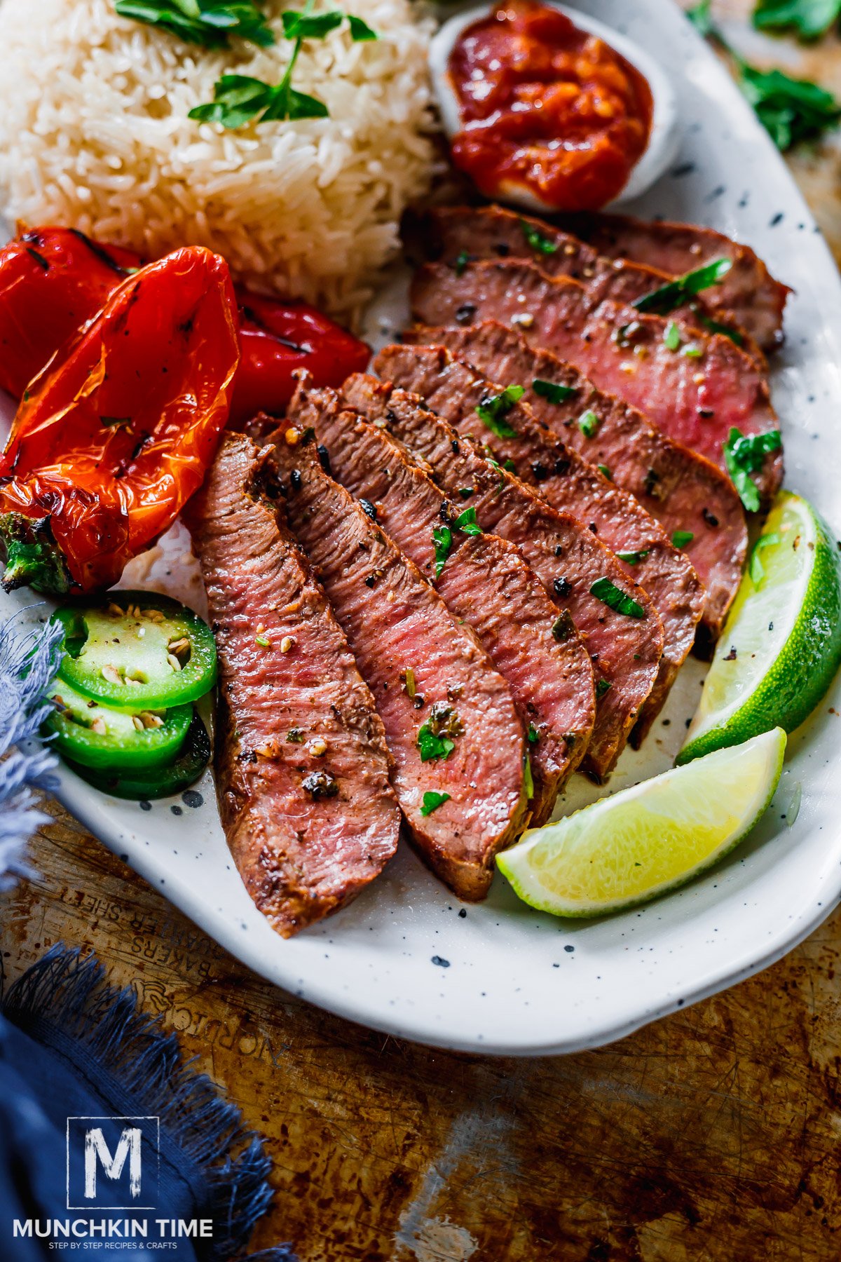 The Best Carne Asada grilled and served with salsa, rice, jalapeno and grilled bell peppers.