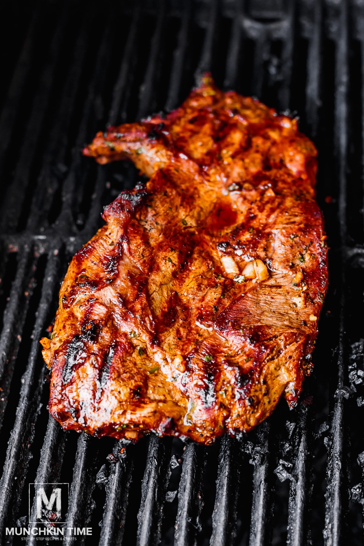 steak grilling on a grill.