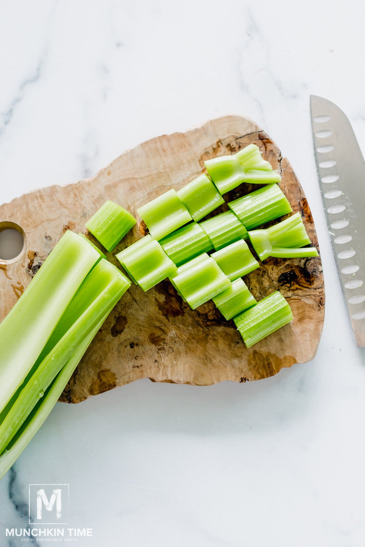 celery chopped on a cutting board.